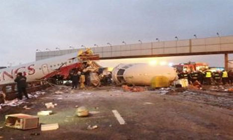 Russian plane crashe into motorway