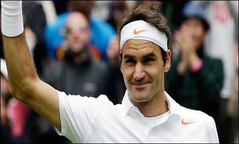 Federer storms into Wimbledon second round